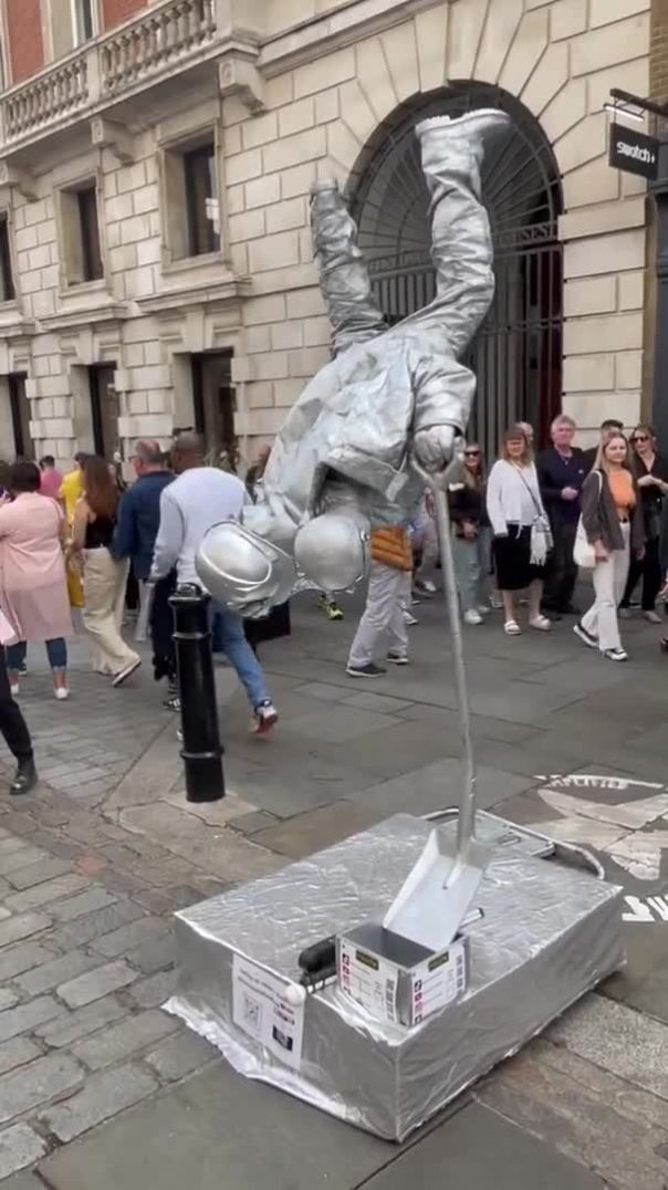 Levitating Silverman Statue Performance In London